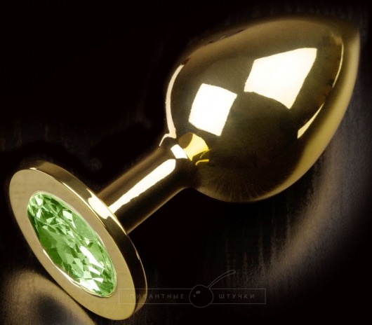 Золотистая анальная пробка с салатовым кристаллом - 9 см. - Пикантные штучки - купить с доставкой в Санкт-Петербурге