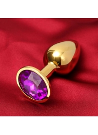 Золотистая анальная пробка с фиолетовым кристаллом - Сима-Ленд - купить с доставкой в Санкт-Петербурге